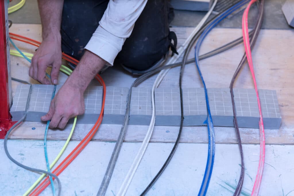 Technician setting-up wires for Aerobarrier installation